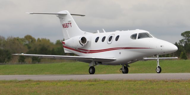 Beechcraft Premier 1 (N567T) - Vertical Dynamics Raytheon Premier 1 departing Runway 19 at H.L. Sonny Callahan Airport, Fairhope, AL, during the 2019 Classic Jet Aircraft Assocation Fly-In and Conference - February 28, 2019. This was the photo ship for air-to-air photography that week.