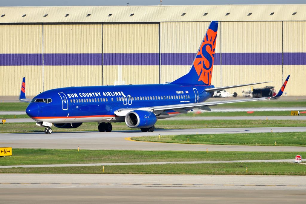 Boeing 737-800 (N829SY) - Taxiing to the active 23-L on 04-30-21. Former ATA hangar in the background, now being used by FDX.