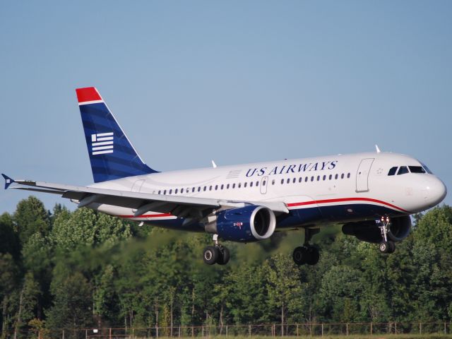 Airbus A319 (N724UW) - Appraoching runway 18C (check out the jet exhaust) - 9/27/09