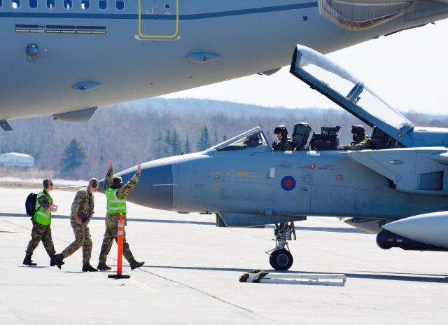 SUW546 — - Royal Air Force pilots are given the " all clear " signal by their mechanical people to depart Gander Airport for the UK on May 16, 2015. It was accompanied by the Airbus Tanker in the photo. The Tornado ZA546 was grounded  here for 6 weeks for repairs. See other related photos on my page.