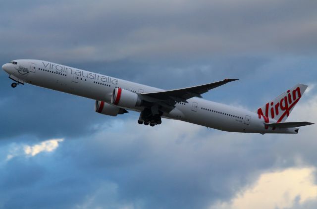 BOEING 777-300 (VH-VPD) - A beautiful 777 owned by Virgin Australia taking to the skies at Sydney during building storms.