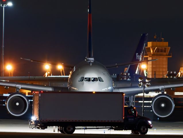 Airbus A330-300 (N823NW) - DAL8865 Heavy, an Airbus A330-300, taxiing to park to awaiting cargo trucks & buses after arriving in Cleveland Ohio on Friday night, 1 Nov 2024. The A330 charter flight brought in the San Diego Chargers for Sundays’ NFL game with the Cleveland Browns.