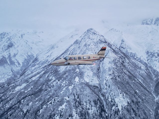 Piper Navajo (N45052) - Anchorage Aero Navajo N45052 cruises north along the Chugach mountains north of Anchorage, AK. 