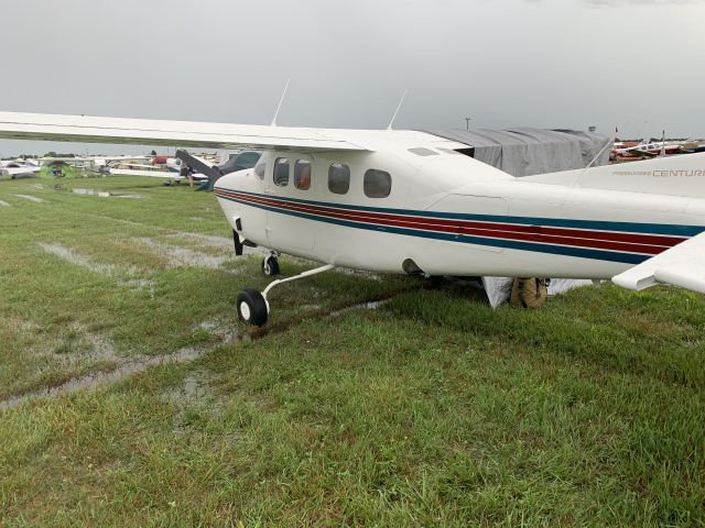 Cessna Centurion (N92CK) - A raining morning at OSH19 Saturday July 20.  Thank goodness we made it in Friday evening.