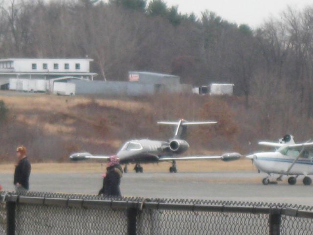 Learjet 35 (N388PD) - Coming around the corner after arriving from Aguadilla, Puerto Rico (TJBQ). The two people walking out of the picture had just come in from a flight with a well-known Fitchburg Pilots Association (FPA) member.