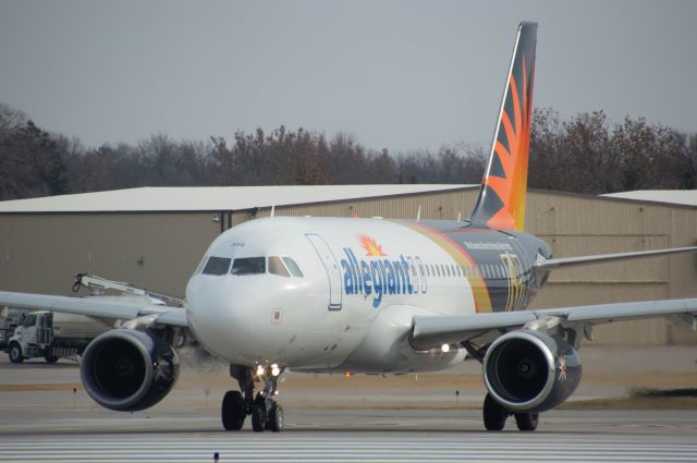 Airbus A319 (N302NV) - Allegiant 226 is turning onto Runway 23 for departure out to Las Vegas at 1;07 PM. This aircraft wears the new Las Vegas Golden Knights livery. I really like the livery and how in the back half of the aircraft is black instead of blue. It would have been cool if they also painted the "Allegiant" titles in black as well to complete the look.