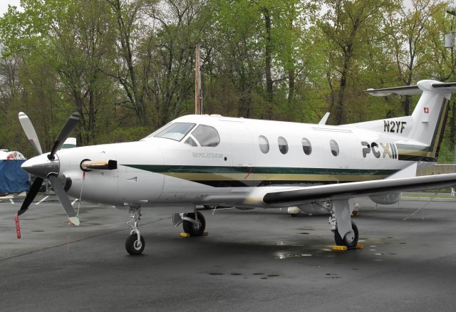 Pilatus PC-12 (N2YF) - A PC12 stands tall on tyh ramp. Here at RELIANT AIR, where you find the lowest fuel price on the Danbury (KDXR) airport.