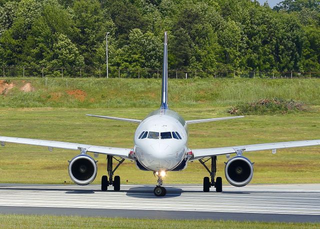 Airbus A319 (N753US) - This Airbus A319 is turning onto runway 18C for takeoff from Charlotte, North Carolina USA