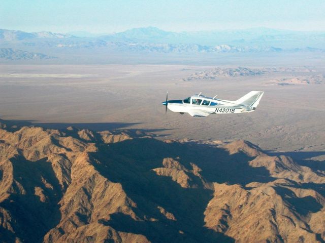 BELLANCA Viking (N4201B) - Setting sun over desert east of Twenty Nine Palms CA.    http://160knots.com