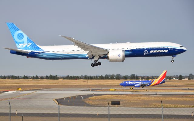 BOEING 777-9 (N779XW) - Boeing's first 777X landing at Spokane International Airport while a Southwest 737 waits to take off.