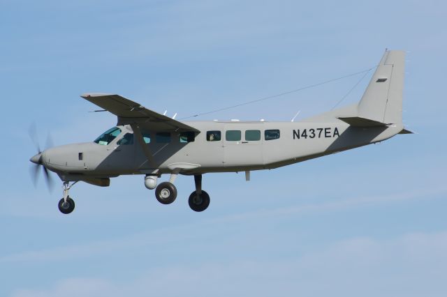 Cessna Caravan (N437EA) - A decked out Cessna 208 with the callsign SAME83 arriving back to Meacham Airport. Notice the wave from the engineer in the back.