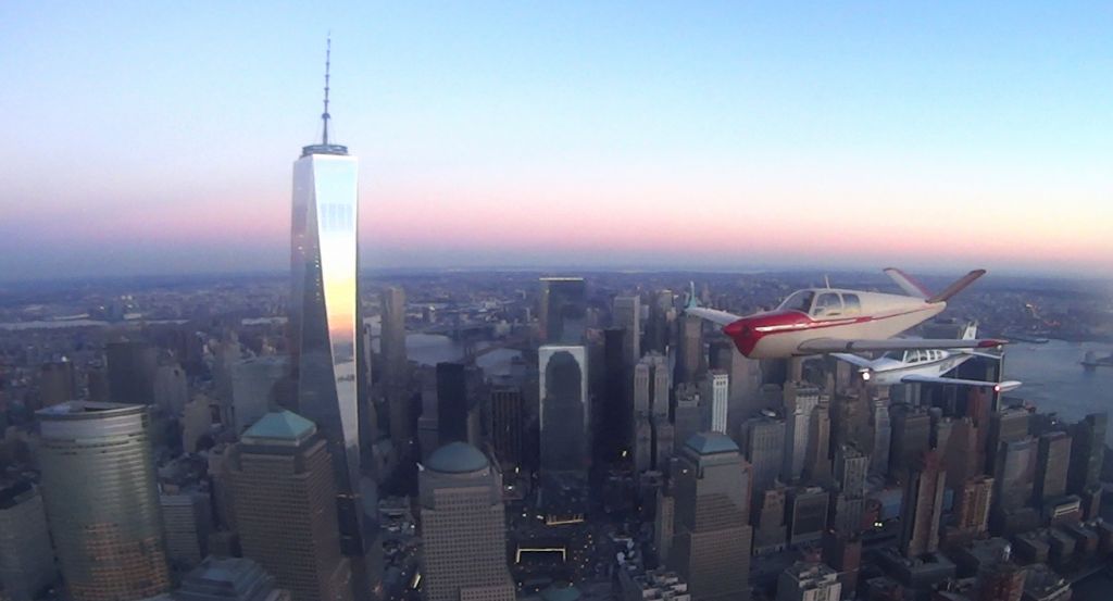 Beechcraft 35 Bonanza (N8789A) - 4 Ship formation freedom tower, 3 A36s & 1 B35