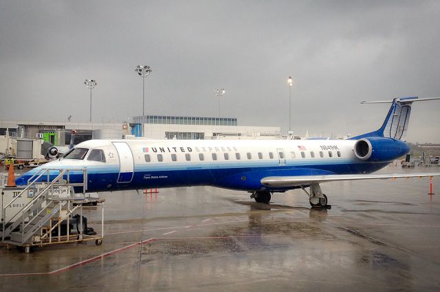 Embraer ERJ-145 (N841HK) - One of the older United Express ERJs operated by Trans-States Airlines parked at the gate, Charleston, S.C.