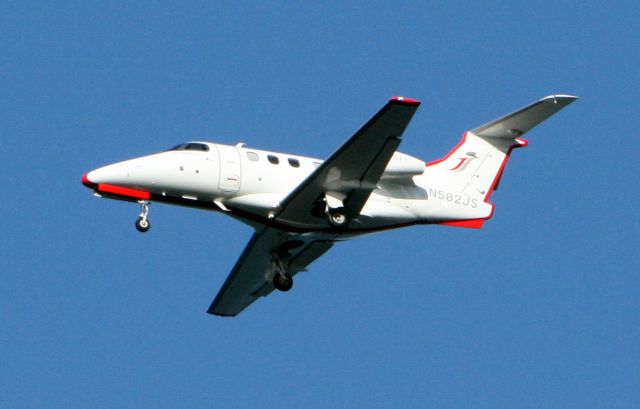 Embraer Phenom 100 (N582JS) - At Coyote Point on approach to KSFO.