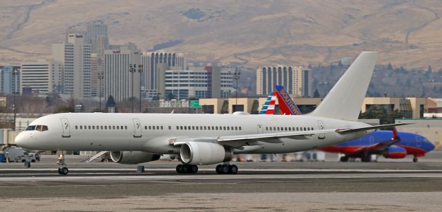 Boeing 757-200 (02-4452) - An all-white US Special Operations Boeing C-32B "Gatekeeper" (B752 variant), 02-4452, call sign "Milo Seven Eight," was clicked here at half past noon on Tuesday, 9 Jan (2018), during its takeoff roll down runway 16R. After an overnight stay in Reno, Milo Seven Eight was departing for Joint Base McGuire/Dix/Lakehurst in New Jersey to complete the second half of a trip from Hawaii (PHJR-KRNO-KWRI).