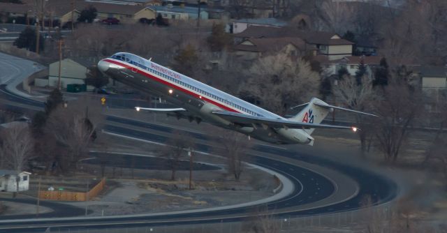 McDonnell Douglas MD-82 (N7519A) - This early dawn takeoff of AAs N7519A captured from Rattlesnake Mountain while it was on the climb away from Reno Tahoe Internationals runway 16R was snapped a couple of years ago.  It was exactly one year ago today, February 9, 2014, that this old Mad Dog was wfu and retired into storage.  I understand the "whys," but I always enjoyed the thunder from these old birds and Im going to miss them.