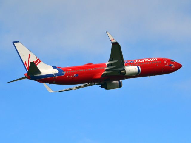 Boeing 737-700 (VH-VUI) - Getting airborne off runway 23 on a gloomy, cold winters day. Wednesday 4th July 2012.