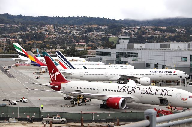 Boeing 787-9 Dreamliner (G-VOWS) - KSFO - Virgin Atlantic "WS" 787-9 being serviced at the Intl terminal along with a few other Globe-trotters.