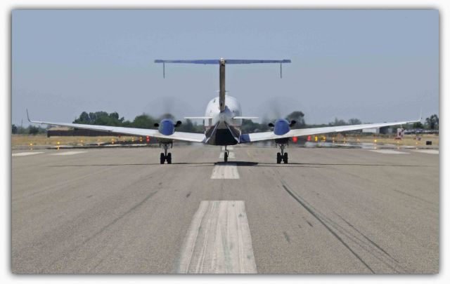 Beechcraft 1900 (N202UX) - Departing, runway Three-Zero