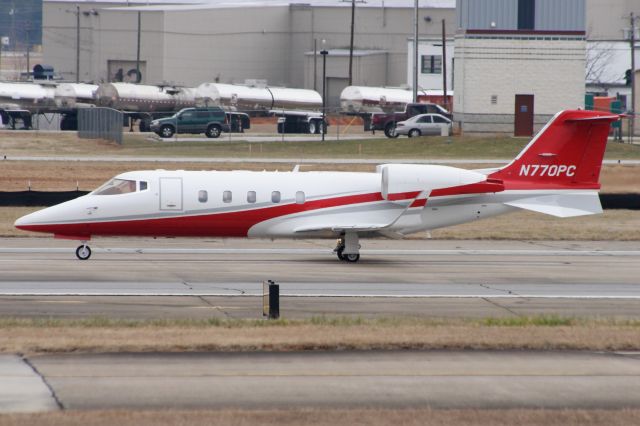 Learjet 60 (N770PC) - Sweet looking Lear 60 back-taxis to RWY 23 for departure. Taxiway Bravo is undergoing construction.