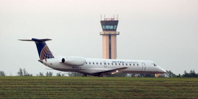 Embraer ERJ-145 (N14568) - A United Express ERJ lined up on Runway 23 and awaiting permission to go from the controller in the KBUF tower in the background.