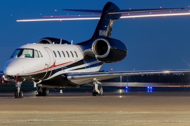 Cessna Citation X (N249AL) - With MAL8088 from YWG zipping by in the back. 