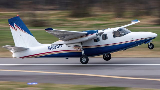 Aero Commander 500 (N698R) - N698R rocketing out of College Park Airport's runway 15 for a flight back to Richmond back in March