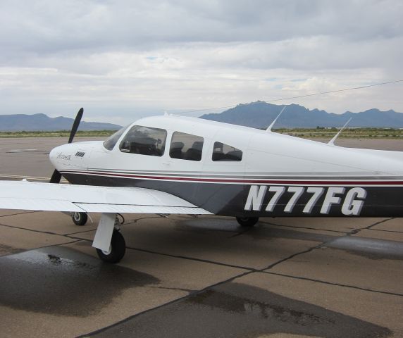 Piper Cherokee (N777FG) - At KDMN waiting out some passing showers.