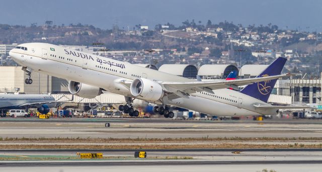 BOEING 777-300 (HZ-AK20) - SVA42 climbs off runway 25R at LAX bound for King Abdulaziz Intl...