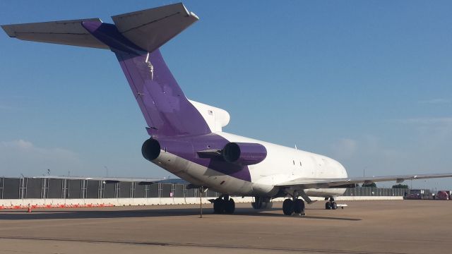 BOEING 727-200 (N487FE) - Fedex donated this 727 to the Austin fire department in 2013. Here she sits stripped of most of her former identity at the Northeast corner of the cargo ramp at AUS on April 8, 2016. She has since been relocated to the North end of an old decommissioned Bergstrom AFB taxiway parallel to 18R/36L. See Google maps.