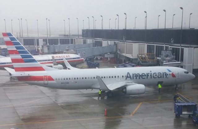 Boeing 737-800 (N965NN) - 2015 Boeing 737-800.  Picture taken from the Admirals Lounge in Terminal 3.  Taken on 5/10/15