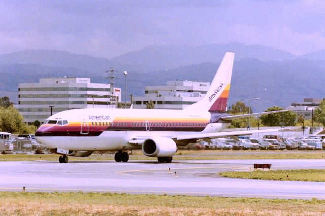 BOEING 737-300 (N304AC) - KSJC - Ex Air Cal N304AC re-reg to N678AA after American took over Air Cal - shown here rolling to 12R for departure to So California. Apprx date 1986-87. Photo from the old long term parking lot back then.