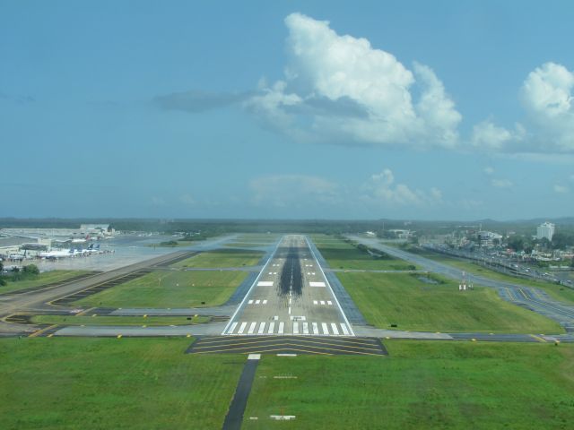 — — - On final to runway 08 at San Juan