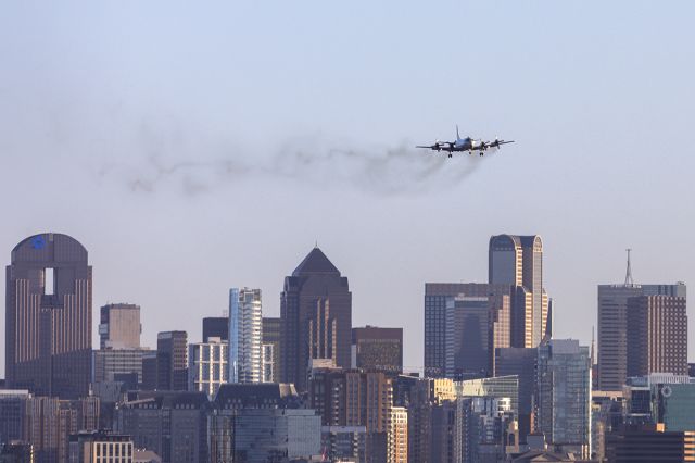 Lockheed P-3 Orion (16-1589) - A smoky P3 arriving over the Dallas skyline from Jacksonville. 