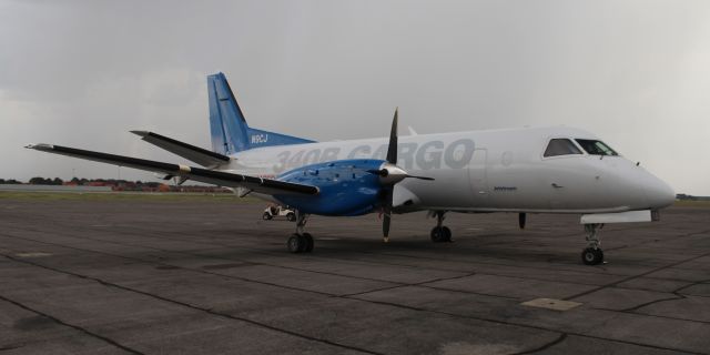 Saab 340 (N9CJ) - An IBC Airways SAAB-Scania 340B on the ramp at Carl T. Jones Field, Huntsville International Airport, AL, with a heavy rain shaft in the background - August 29, 2018.