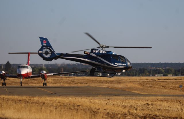 Eurocopter EC-130 (N911EH) - KRDD July 5th, 2025 camera shy N911EH landed at the Redding REACH/PHi medical helicopter base late afternoon for fuel. Arriving from the NE it set down for about 45minutes before departing here with a *hot dog* departure straight for Enloe Hospital in CIC-Chico California helipad at the hospital. This is the first time I have seen this medical chopper.