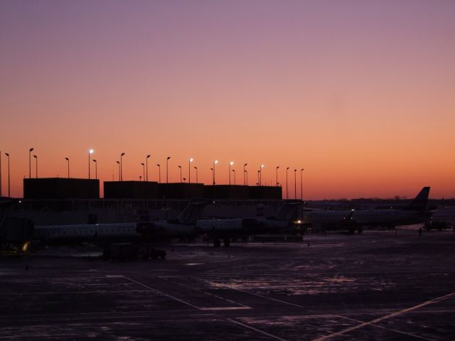 — — - Sunset at ORD after the Blizzard of December 2009