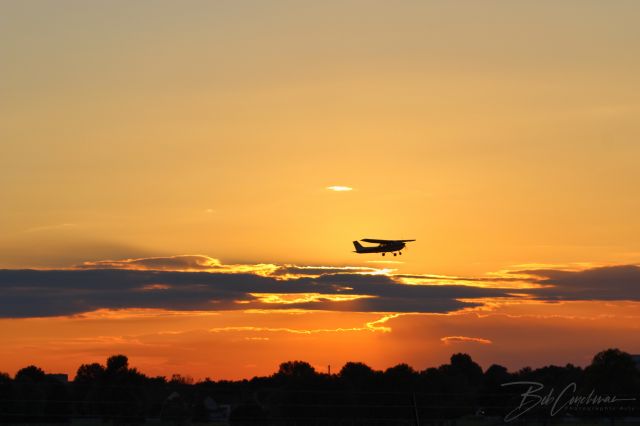 — — - Unknown Aircraft departing in the sunset