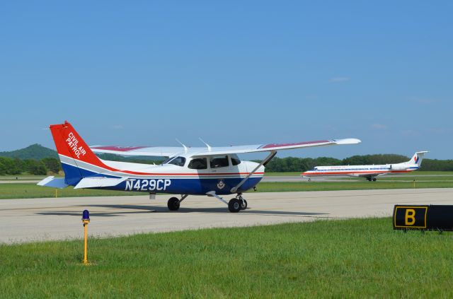 Cessna Skyhawk (N429CP) - Deke Slayton Airfest June 2014. CAP C-172 N429CP waiting for AA commuter to pass in order to taxi back to hangar from display area. I loved flying this aircraft with the La Crosse Composite Squadron. She looked a lot prettier with her wheel pants on but CAP had us remove all wheel pants because they felt their presence was discouraging routine tire pressure checks.