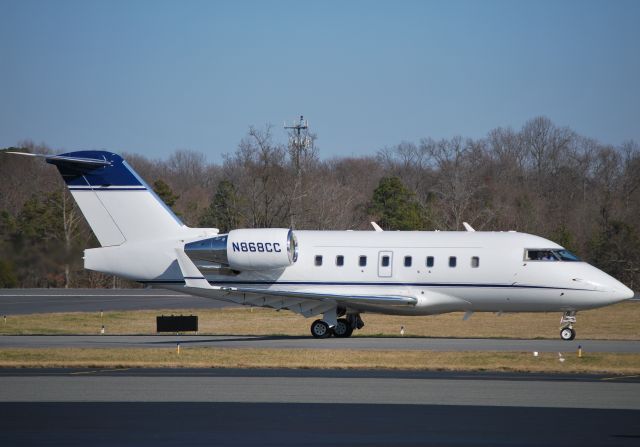 Canadair Challenger (N868CC) - MHS TRAVEL &amp; CHARTER INC taxiing to runway 2 at KJQF - 2/20/12