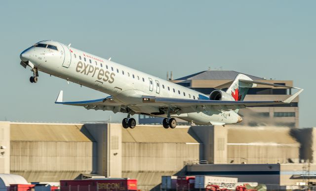 Canadair Regional Jet CRJ-900 (C-FJJZ) - Jazz8520 blasts off runway 24L at Montreal on her way to Winnipeg