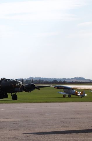 De Havilland Fox Moth (F152A) - Out on the Tarmac with Sally B the last flying B-17 in the world.