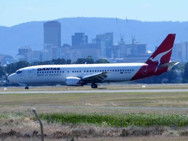 BOEING 737-400 (VH-TJY) - On taxi-way, heading for Terminal 1 after landing on runway 23. Wednesday 4th January 2012.