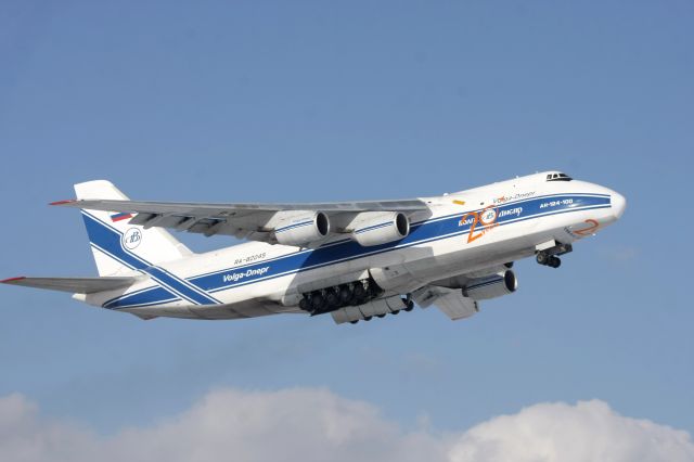 Antonov An-124 Ruslan (RNA82045) - Gear doors open for retraction on the slow climb off Runway 14 on Feb 11, 2011 as flight VDA2118 to KNUQ