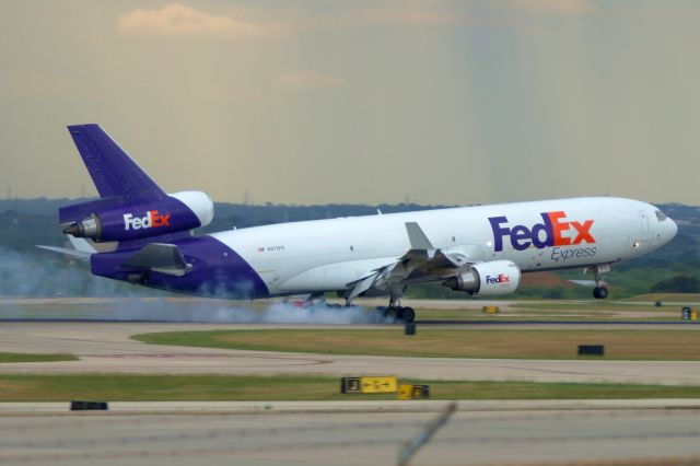 Boeing MD-11 (N572FE) - 12R arrival.