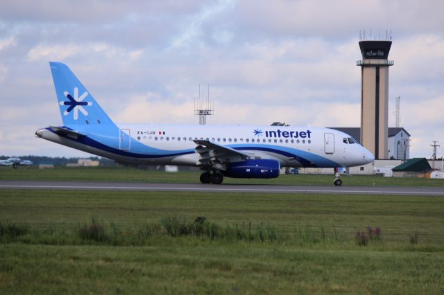 Sukhoi Superjet 100 (XA-IJR) - The second Sukhoi SSJ95 of InterJet of Mexico rolls past the control tower at Bangor International Airport at the end of an import flight.