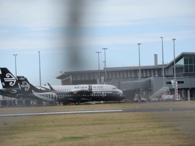 Aerospatiale ATR-72-600 (ZK-MVA) - At Gates. ATR 72 Passes A Air New Zealand A320 (ZK-OXC) While Taxiing to Gate.