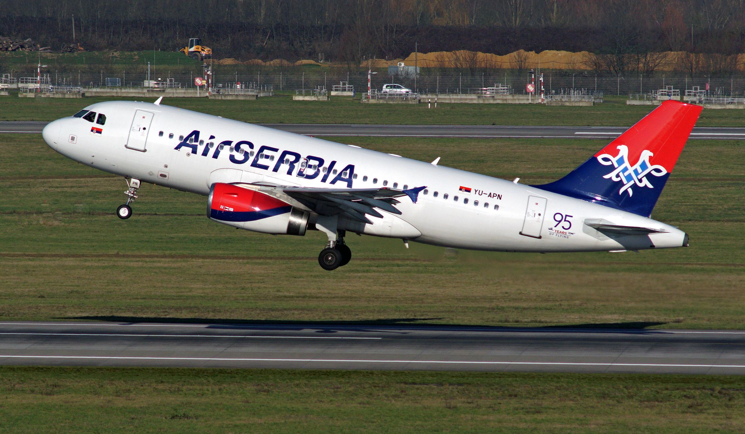 Airbus A319 (YU-APN) - take off at DUS with special logo "95 YEARS OF FLYING"