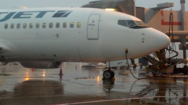 Boeing 737-700 (C-GRWS) - The james bond 007 jet. Look at the fin number on the nose gear. Can you spot the gun?