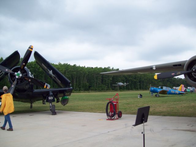 — — - A T-6 Texan just after take off under the B-25 wing.